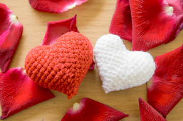Heart with red roses on wood background