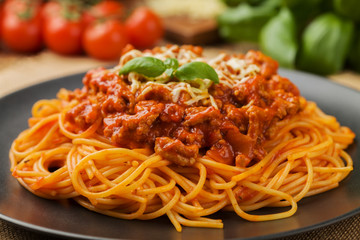 Delicious spaghetti served on a black plate