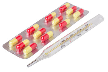 Packaging pills with thermometer isolated on white background