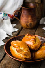 Pies stuffed meat on wooden background, ukrainian or russian cuisine. Selective focus