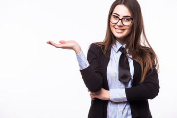 Portrait of happy smiling young cheerful businesswoman, showing something or blank copyspace area for slogan or text message, on white background, with blank copyspace area for slogan or text