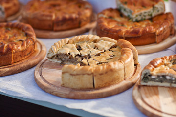 Homemade pie  with different fillings on wooden boards