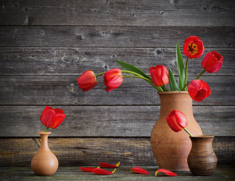  tulips bouquet on wooden table