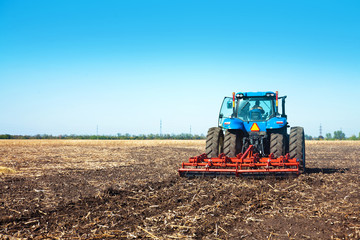 Blue tractor in the field