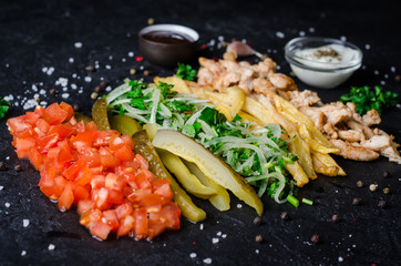 Ingredients for Shawama sandwich with spices and sauces on dark background. Selective focus....