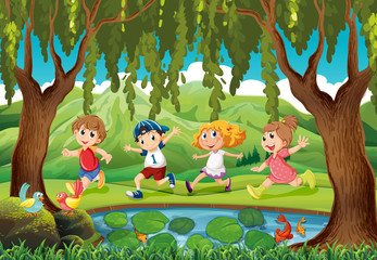 Four kids running in the park