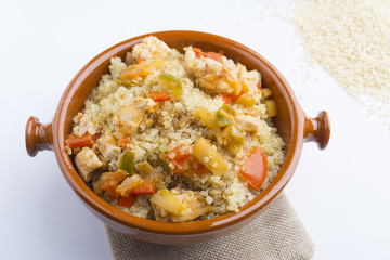 High-key image of white plate with quinoa lentil salad and bowl