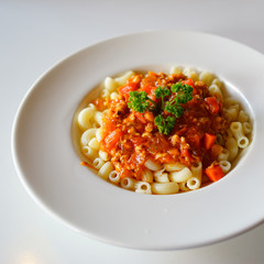 Fried macaroni with chicken . close soft focus