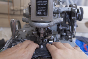 25 September 2012 at a tailor in Barcelona, Spain. Production process of suit tailoring. Sewing of parts of a tailored jacket