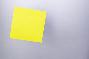 Blank sticky note on The refrigerator (for your text)