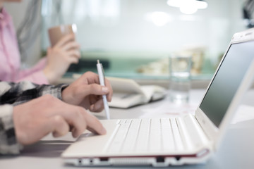Fototapeta premium Modern Office Background Computer and male Hands touching Keyboard