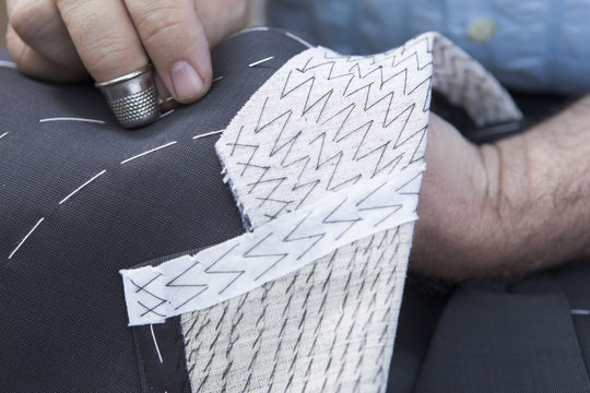 25 September 2012 At A Tailor In Barcelona, Spain. Production Process Of Suit Tailoring, Hand Sewing Of A Tailored Jacket