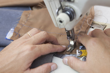 25 September 2012 at a tailor in Barcelona, Spain. Production process of suit tailoring. Sewing of parts of a tailored jacket