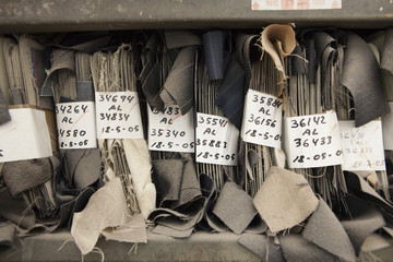 archive of textile samples. production of fine woolen fabrics for suits - in a factory in Sabadell, Spain