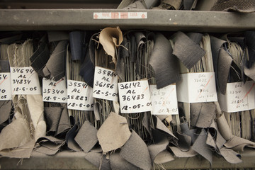 archive of textile samples. production of fine woolen fabrics for suits - in a factory in Sabadell, Spain