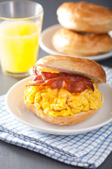 breakfast sandwich on bagel with egg bacon cheese