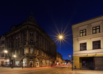 Fototapeta na wymiar Architecture of Piotrkowska Street after sunset in Lodz, Poland.
