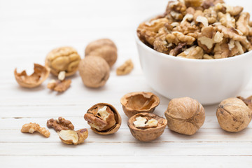 walnuts on white wooden background