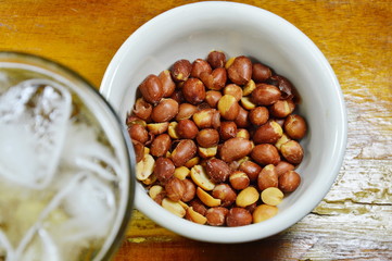 salt peanut and beer on table