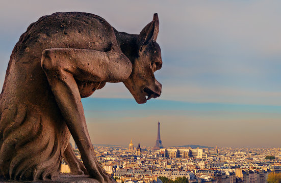 Gargoyle on Notre Dame with view of Paris in the background, Paris, France