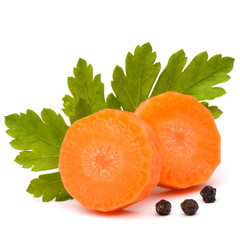 Chopped carrot slices and parsley herb leaves still life isolate