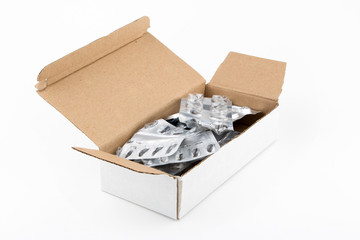empty packets of prescription medicine in cardboard box