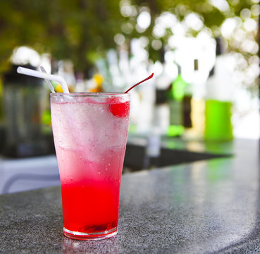 Strawberry Red Cocktail Garnished With Cherry