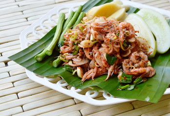 shrimp spicy salad with herb on fresh banana leaf