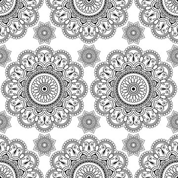 Seamless pattern with black mehndi floral henna lace buta decoration items in Indian style.