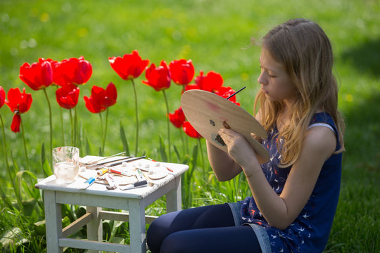 Young artist painting a landscape, Painting Flowers 
