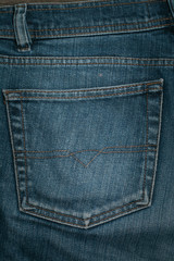 Fototapeta premium Blue jeans back pocket. Background.