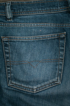 Blue jeans back pocket. Background.