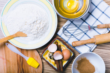 Wooden background with baking ingredients. Top view.