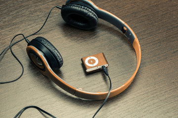 headphones on wooden background