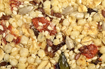 sesame, sunflowers and other seeds with dried fruits  as background.