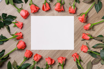 Happy Mother's Day. Greeting card and red rose on wooden backgound. 