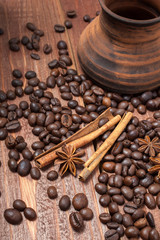 Coffee beans and spices on a wooden table