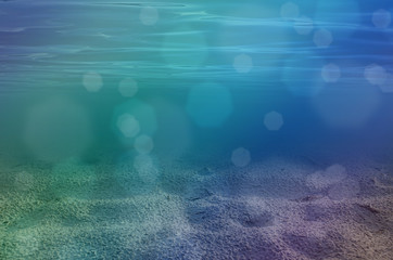 Underwater background with sandy sea bottom