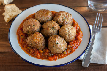 Spanish pisto (typical vegetables stew) with meatballs