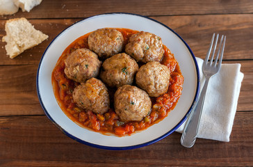 Spanish pisto (typical vegetables stew) with meatballs