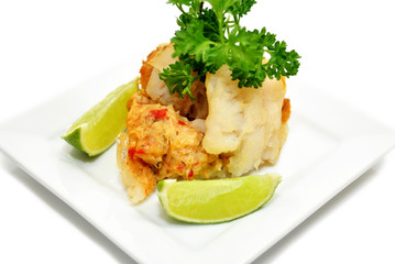 Stuffed White Fish Appetizer Garnished with Fresh Parsley & Lime