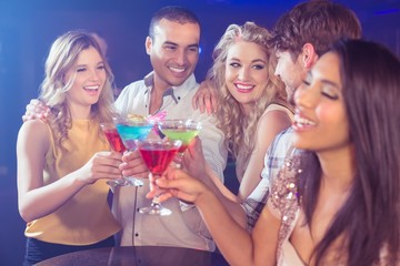 Happy friends with cocktails