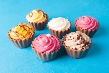 Birthday cupcakes on blue background. many sweet  cupcakes