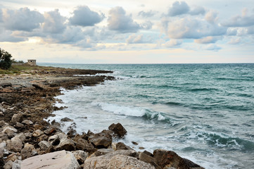 Fototapeta na wymiar Ostuni, sea on the rocks in a summer cloudy day, Apulia, Italy