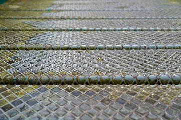 Floor-slip metal with blur in perspective