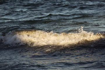 Beautiful light over small waves on ocean