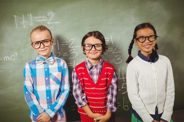 Children standing in front of blackboard