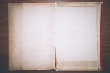 Vintage book, open, on wooden background