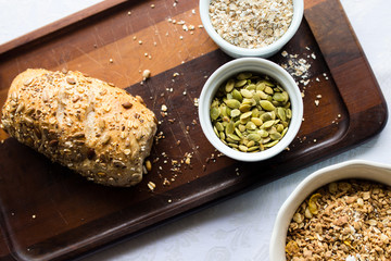 Pumpkin seeds, oats, and mix of grains with bread 