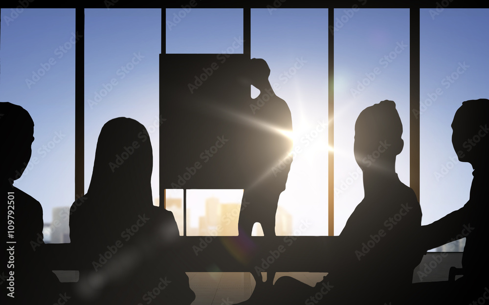 Wall mural business people silhouettes at meeting in office